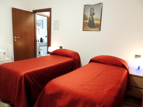Ένα ή περισσότερα κρεβάτια σε δωμάτιο στο foresteria re artù
