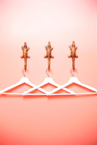 a group of crosses hanging on a wall at Hotel Bruno in Middelburg