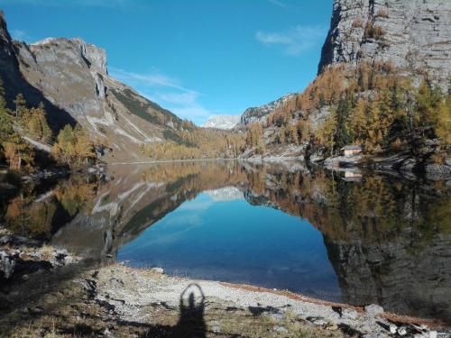 a reflection of a mountain in a crater lake at Ferienwohnung Wohlfahrter in Bad Mitterndorf