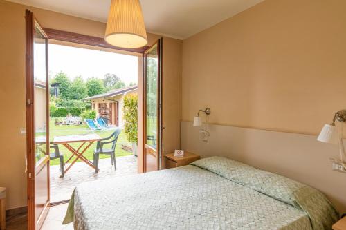 Postel nebo postele na pokoji v ubytování Villa Rosy