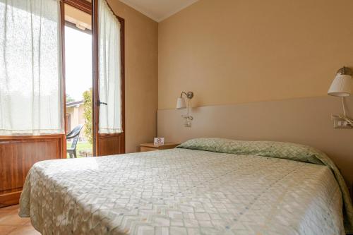 Ένα ή περισσότερα κρεβάτια σε δωμάτιο στο Villa Rosy