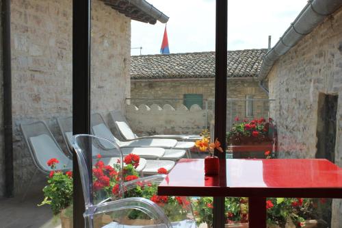 a group of tables and chairs on a patio at Hotel Sorella Luna in Assisi