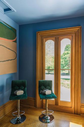 two chairs in a room with a window at Merrill House in Picton