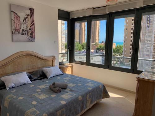 Postel nebo postele na pokoji v ubytování GEMELO 23 APARTMENT BEACH LEVANTE