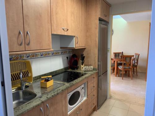 Kuchyň nebo kuchyňský kout v ubytování GEMELO 23 APARTMENT BEACH LEVANTE