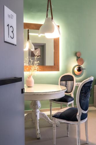 a dining room with a table and two chairs at apt.27-103 in Nafplio