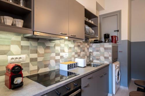 a kitchen with a sink and a counter top at apt.27-103 in Nafplio