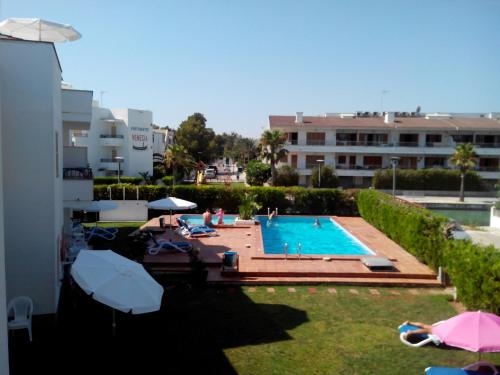 a view of a swimming pool in a building at Venecia Apartments in Port d'Alcudia