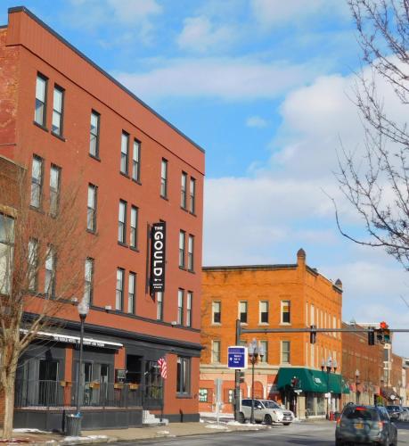 a brick building on the corner of a street at The Gould Hotel in Seneca Falls