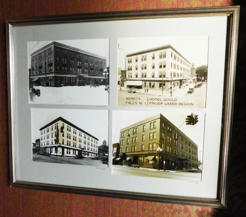a framed picture of three buildings in a picture frame at The Gould Hotel in Seneca Falls