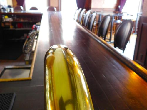 a close up of a table with chairs behind it at The Gould Hotel in Seneca Falls