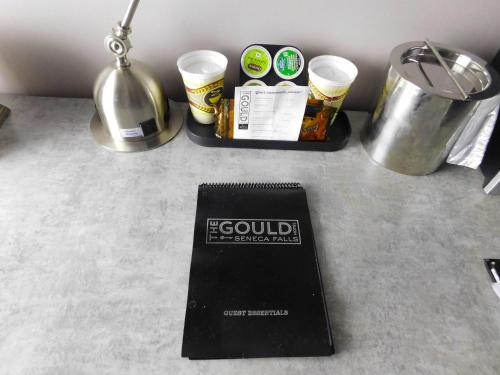 ein Buch auf einer Theke mit Essen in der Unterkunft The Gould Hotel in Seneca Falls