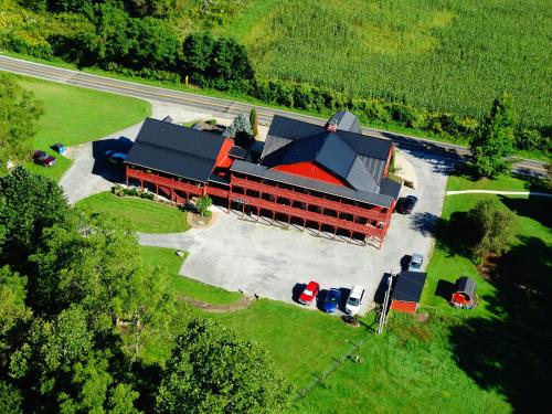 an overhead view of a large building with a garage at The Barn Inn Bed and Breakfast in Millersburg