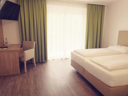Un ou plusieurs lits dans un hébergement de l'établissement Hotel Auszeit