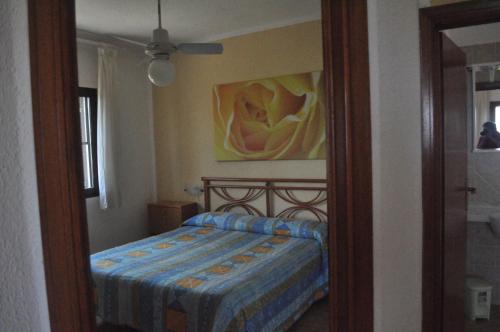a bedroom with a bed and a mirror at Residence Belvedere in Capoliveri