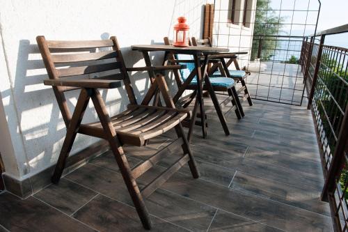 a group of chairs and a table on a balcony at Villa Pavlina in Ohrid