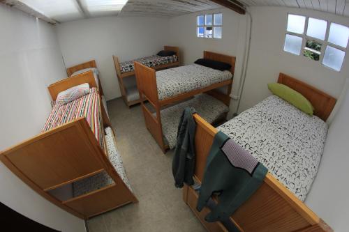 Ένα ή περισσότερα κρεβάτια σε δωμάτιο στο Coruña Backpackers Hostel