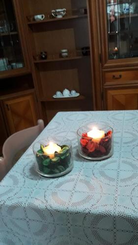 two candles sitting on top of a table at 4 stagioni in Villasimius