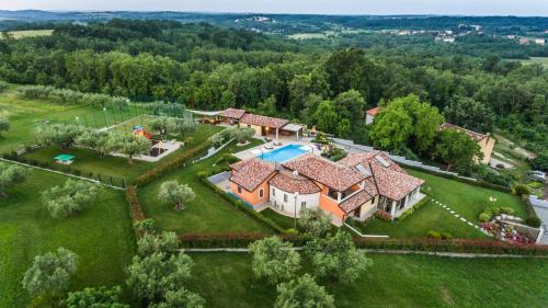an aerial view of a house with a swimming pool at Villa GioAn - max 18, Private Playground and Sea View in Materada