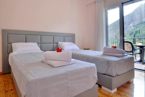 Postel nebo postele na pokoji v ubytování Anastasios Paleokastritsa apartment