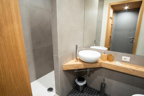 a bathroom with a sink and a mirror at Chill in Tuscany in Lucca