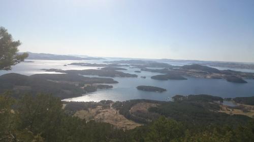 a view of a lake with islands in the water at Dada Apartment in Hjelmeland