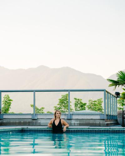 a woman standing in the water in a pool at Fairmont Waterfront in Vancouver