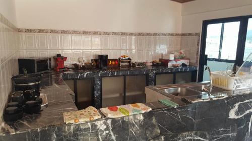 a kitchen with a counter top and a sink at Casa de Mármol in Riobamba