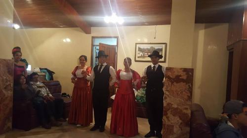 a group of people posing for a picture at a wedding at Casa de Mármol in Riobamba