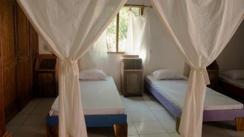 Tempat tidur dalam kamar di VH Surf Camp