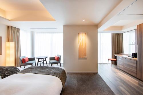 Ένα ή περισσότερα κρεβάτια σε δωμάτιο στο karaksa hotel premier Tokyo Ginza
