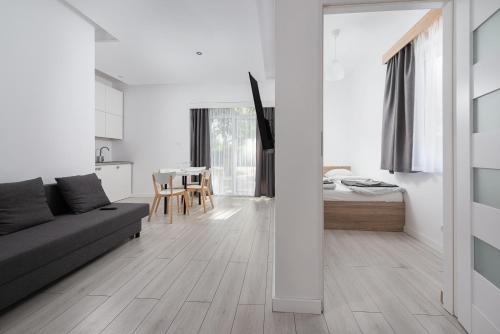Postel nebo postele na pokoji v ubytování Nowe Apartamenty Puck