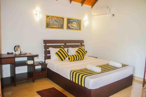 Posteľ alebo postele v izbe v ubytovaní Sigiriya Nature Resort