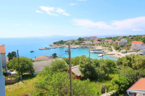 a view of a harbor with boats in the water at Apartments Delminium in Lun