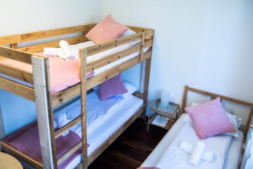 Postel nebo postele na pokoji v ubytování Harmony Hostel