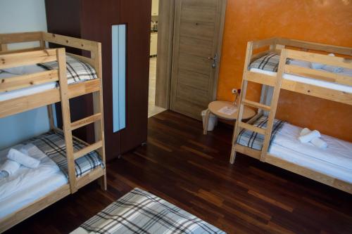Postel nebo postele na pokoji v ubytování Harmony Hostel