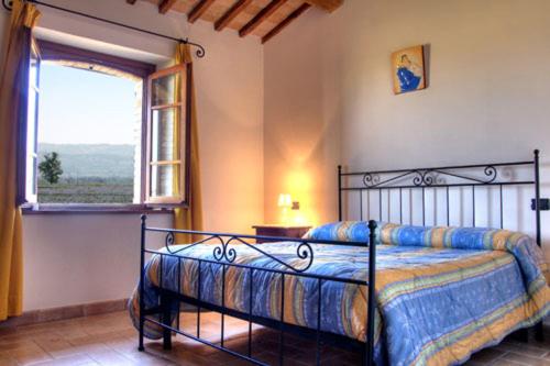 Ένα ή περισσότερα κρεβάτια σε δωμάτιο στο Agriturismo Bellarosa