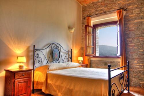Ένα ή περισσότερα κρεβάτια σε δωμάτιο στο Agriturismo Bellarosa