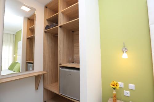a laundry room with a washer and dryer at Sun Hotel in Polykhrono