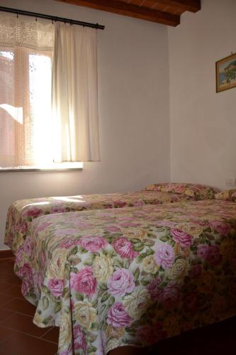 Katil atau katil-katil dalam bilik di Agriturismo La Querce