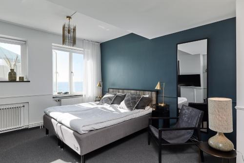 מיטה או מיטות בחדר ב-Varbergs Kusthotell