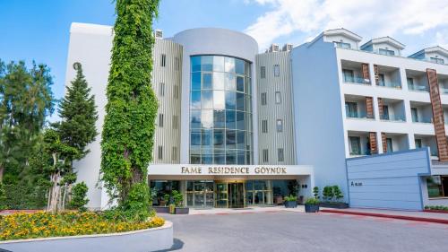 a view of the pine neuroscience center building at Fame Residence Goynuk in Kemer