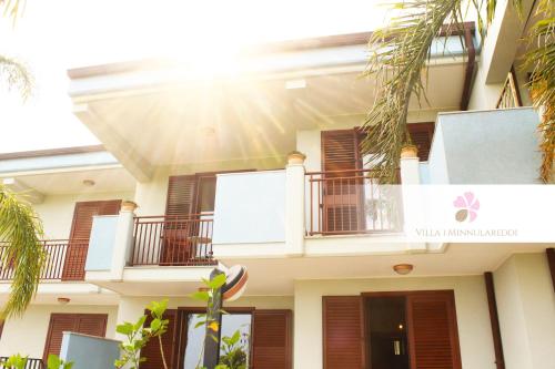 a building with balconies on the side of it at Villa i Minnulareddi in Giardini Naxos