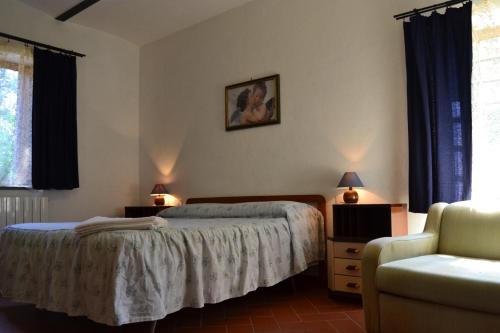 Postel nebo postele na pokoji v ubytování Agriturismo La Querce