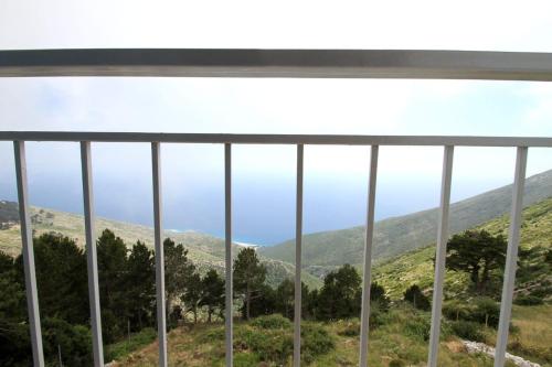 a view of the mountains from a window at Hotel Keshtjella Llogara in Vlorë