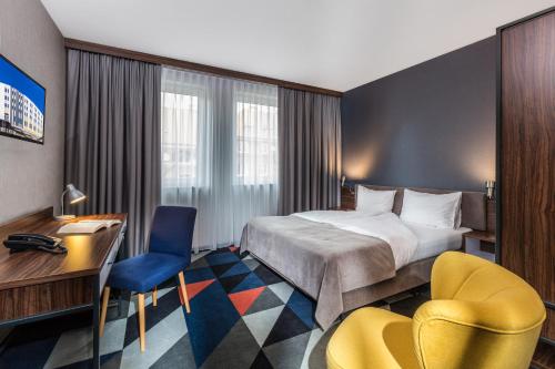 Postel nebo postele na pokoji v ubytování Vulcan Hotel