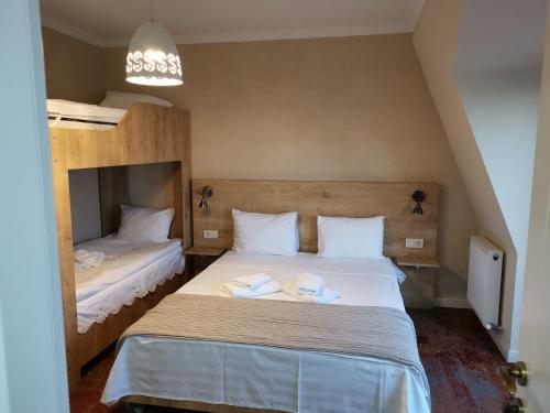 Postel nebo postele na pokoji v ubytování Boutique Hotel BelleVue