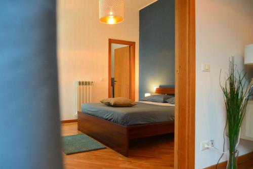 Un pat sau paturi într-o cameră la Dimora Paternò