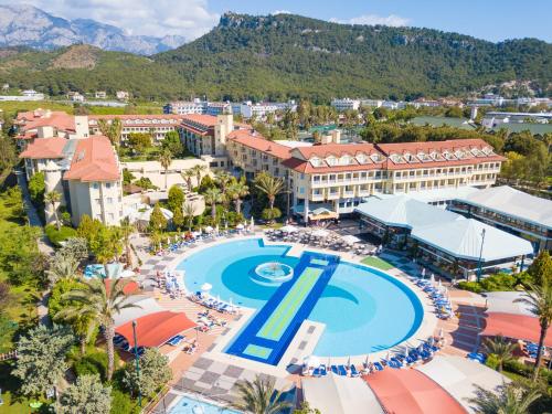 an aerial view of a resort with a swimming pool at Queen's Park Le Jardin in Kemer