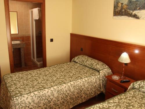 Cama o camas de una habitación en Nuevo Hostal Paulino